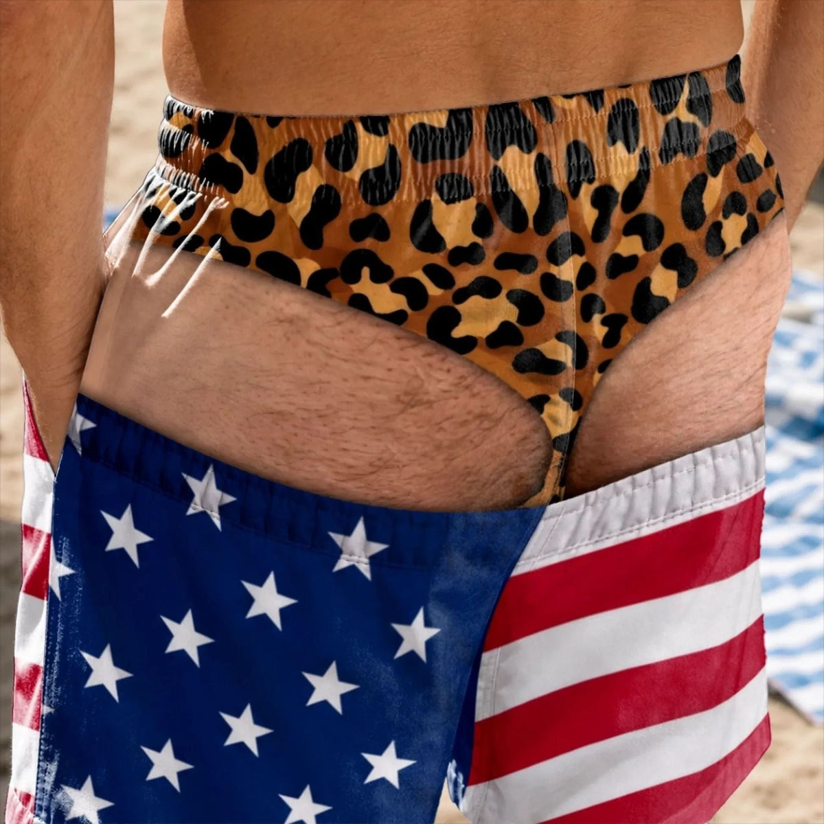 Urbanomax™ patriotic swim trunks with red, white, and blue flag design, displayed flat on a white background.